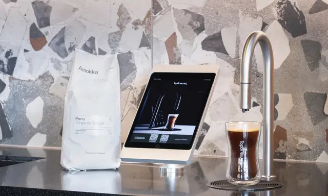 Close up of TopBrewer with bag of Amokka Peru coffee beans