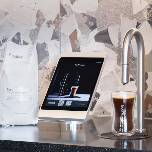 Close up of TopBrewer with bag of Amokka Peru coffee beans